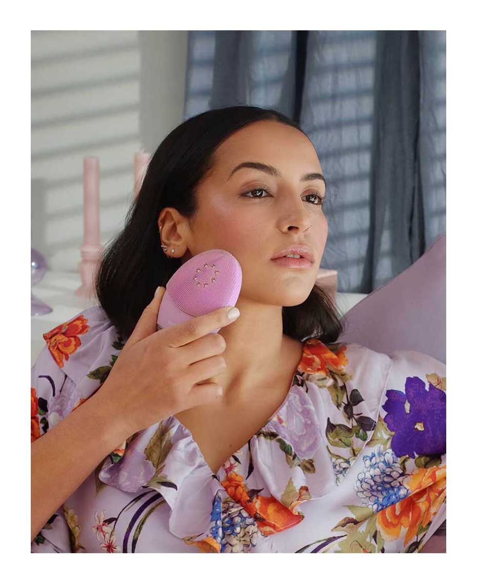 Foreo Luna 3 Plus facial cleansing device for normal skin, made of light pink silicone, shown in close-up. - thumbnail 2