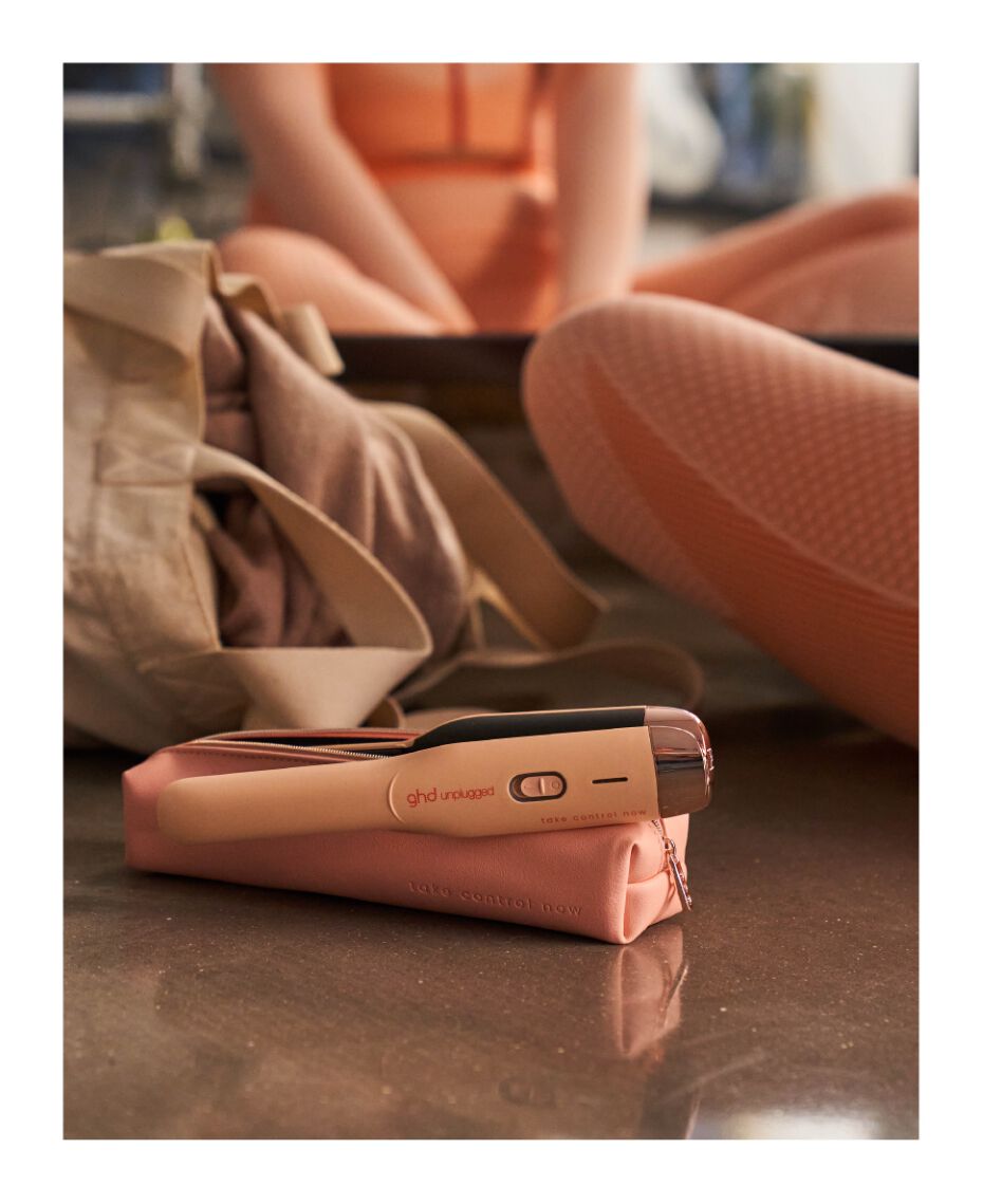 ghd unplugged cordless hair straightener in pink peach